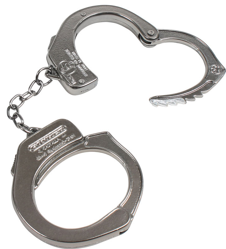 Håndjern i metal og politi badge